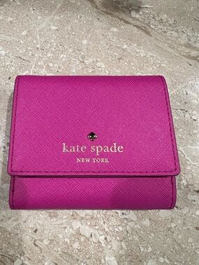 kate spade fushia/pink leather compact wallet with gold logo